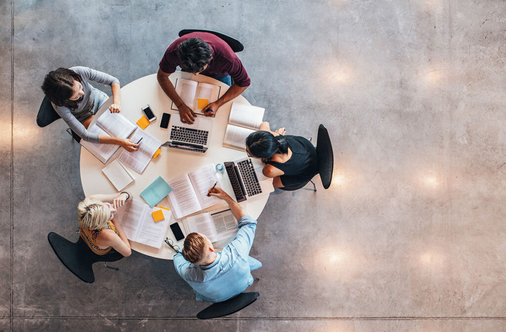 group of college students working on a table