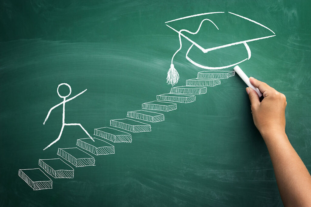 stick figure running up stairs to reach graduation cap